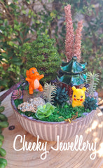 Pikachu and Charmander pokemon inspired themescapes gardens with Crystal. Imagination play.
Pretend play, decor, and collectables.